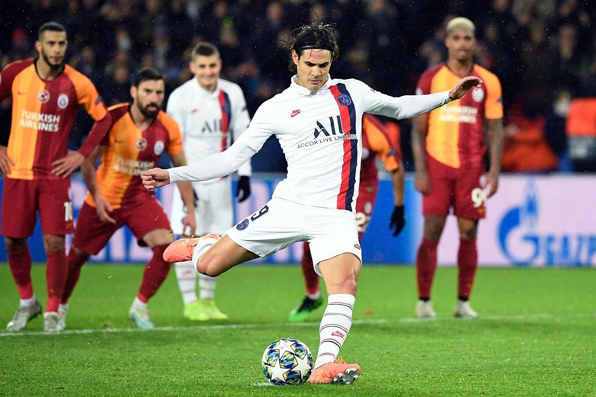 In this file photo taken on December 11, 2019 Paris Saint-Germain's Uruguayan forward Edinson Cavani shots and scores from the penalty spot. (AFP Photo)