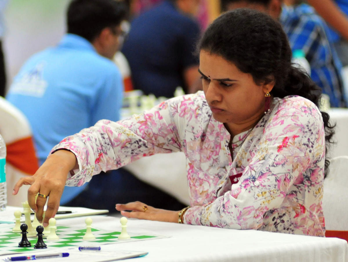 Koneru Humpy plays against Lalith Babu M R during All India Public Sector Chess Tournament, at Hotel Sandesh The Prince in Mysuru. (DH Photo)