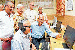 art: Journalist N&#8200;Murali listens to music at digital archives launched at Mysore on Thursday. R&#8200;T&#8200;Chari,&#8200;C&#8200;G&#8200;Narasimhan, Pappu&#8200;Venugopal&#8200;Rao and S&#8200;R&#8200;Krishnamurthy are seen. DH Photo