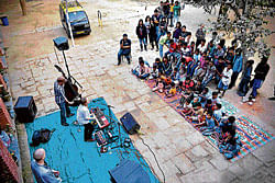 street show Musicians perform to entertain street kids.