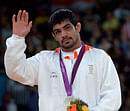 Silver medalist Sushil Kumar of India during the medals ceremony for men's 66-kg freestyle wrestling at the 2012 Summer Olympics in London on Sunday. PTI