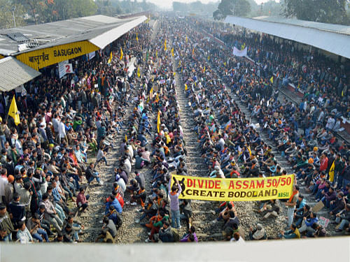 Activists of the All Bodo Students' Union (ABSU) block tracks during their a 12-hour railway blockade protest demanding separate Bodoland state in Chirang district of Assam on Tuesday. PTI File Photo