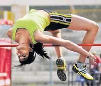 Mighty leap: Sahana Kumari of South Western Railway en route to her high jump gold on Saturday. DH Photo