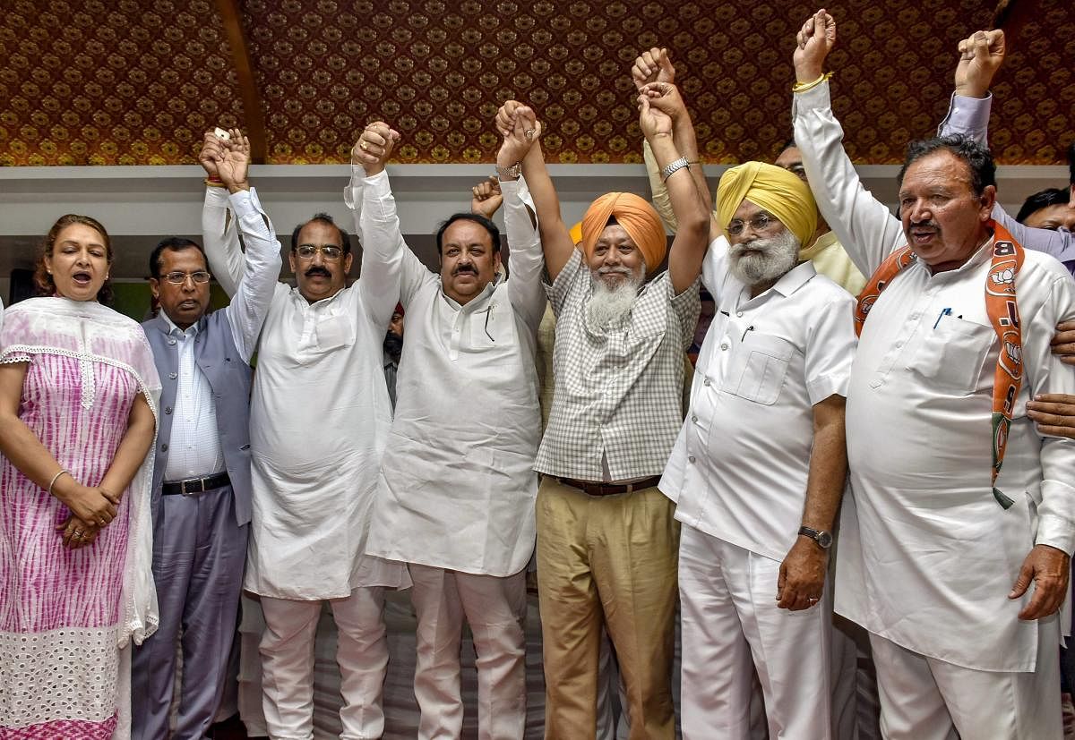 Fatehgarh Sahib MP Harinder Singh Khalsa, who recently joined BJP leaving the AAP, with other BJP leaders and workers during his Lalkar rally, in Amritsar, Sunday, April 7, 2019. (PTI Photo)
