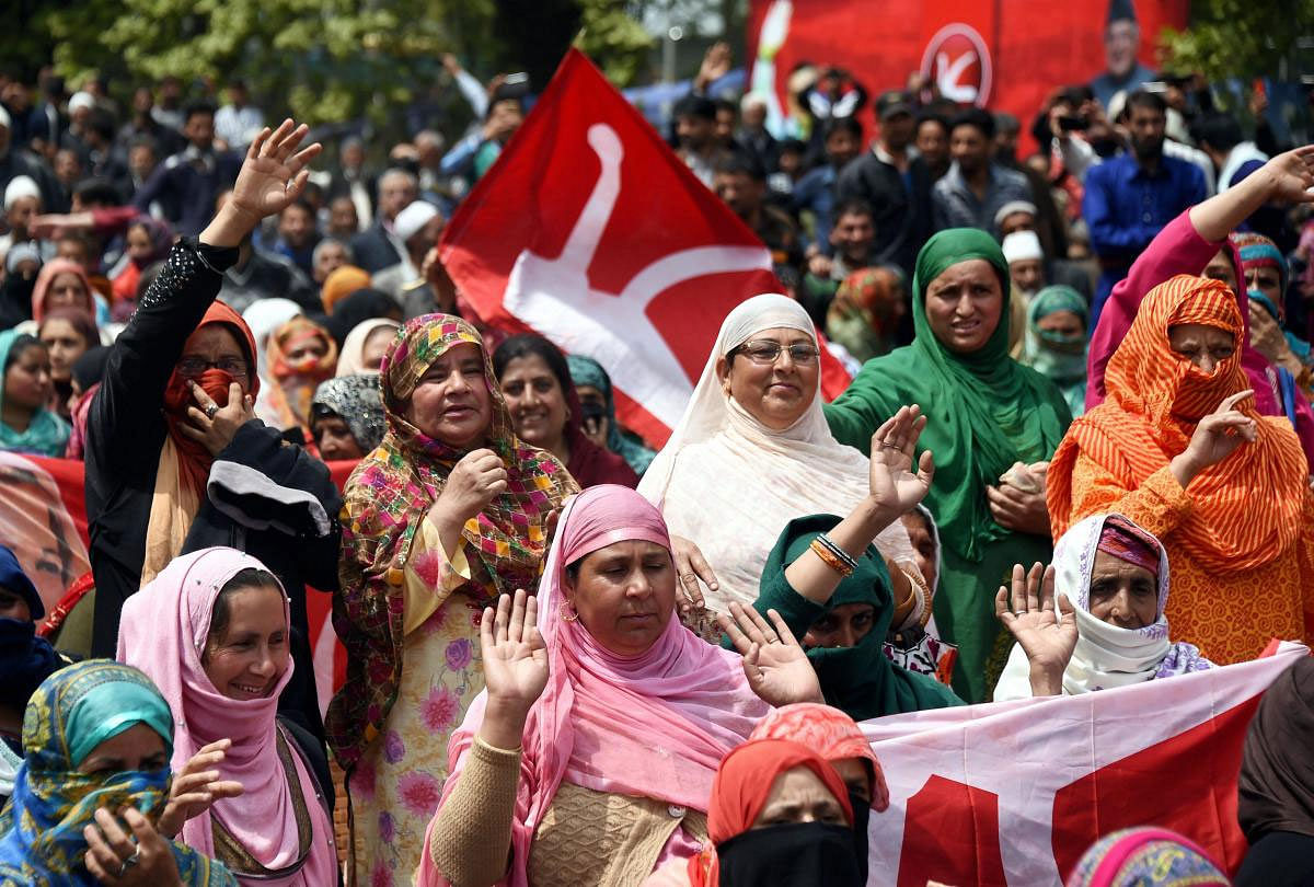 Supporters of Jammu and Kashmir National Conference (JKNC) during an election rally, in Srinagar, Monday, April 15, 2019. (PTI Photo)