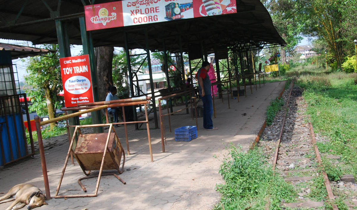 There is no toy train at Raja Seat, Madikeri, and the line is covered in weeds.