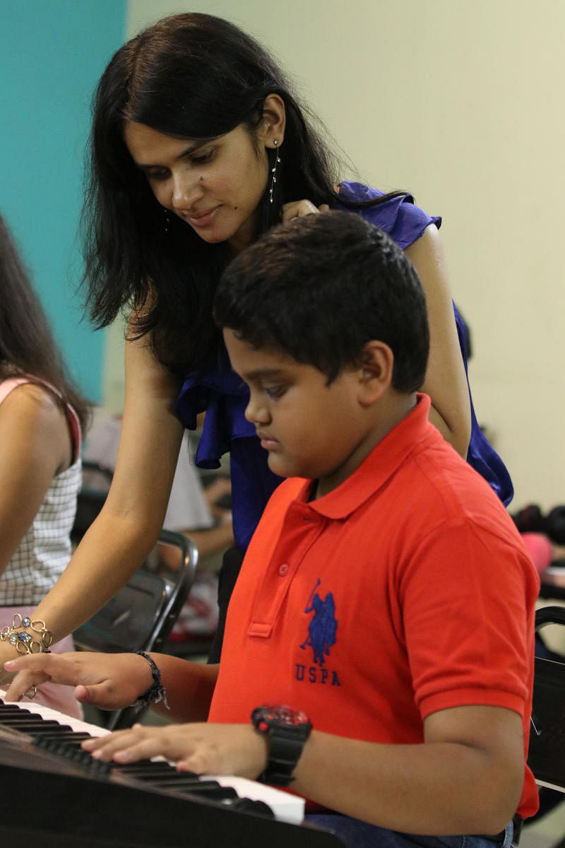 Padmapriya HJ, keyboard teacher, with one of her students.
