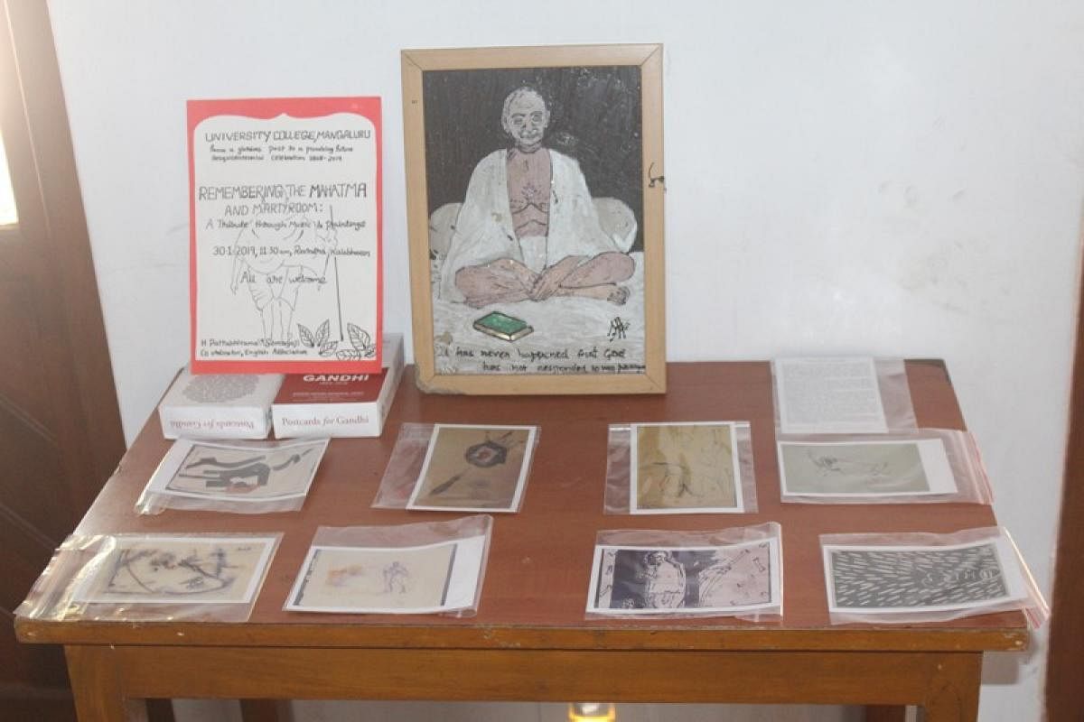 Art work on Mahatma Gandhi displayed to pay tribute to Mahatma Gandhi through music and paintings organised by English Association of University College, Mangaluru.