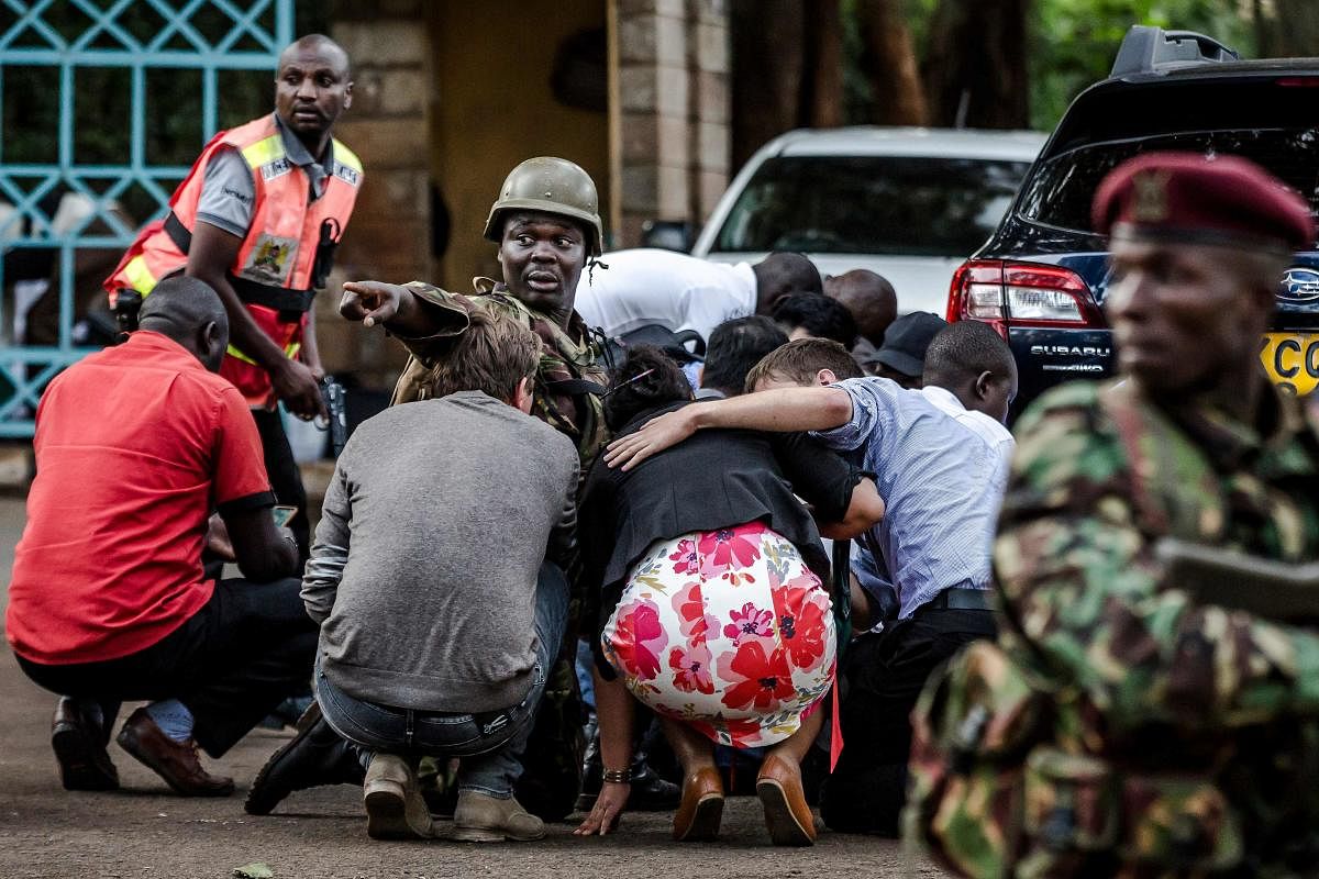 In this file photo taken on January 15, 2019 Special forces protect people at the scene of an explosion at a hotel complex in Nairobi's Westlands suburb. (AFP Photo)