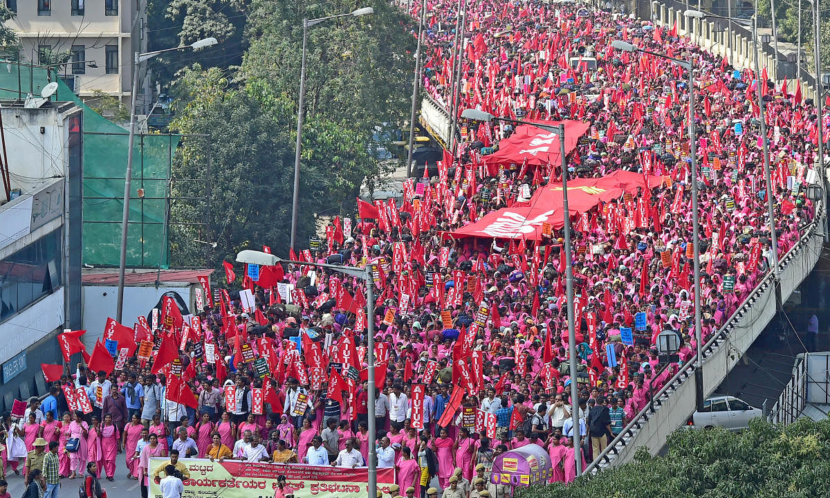 Nearly 30,000 Accredited Social Health Activist (ASHA) from across Karnataka held a massive rally and a day-long protest in Bengaluru on Friday.