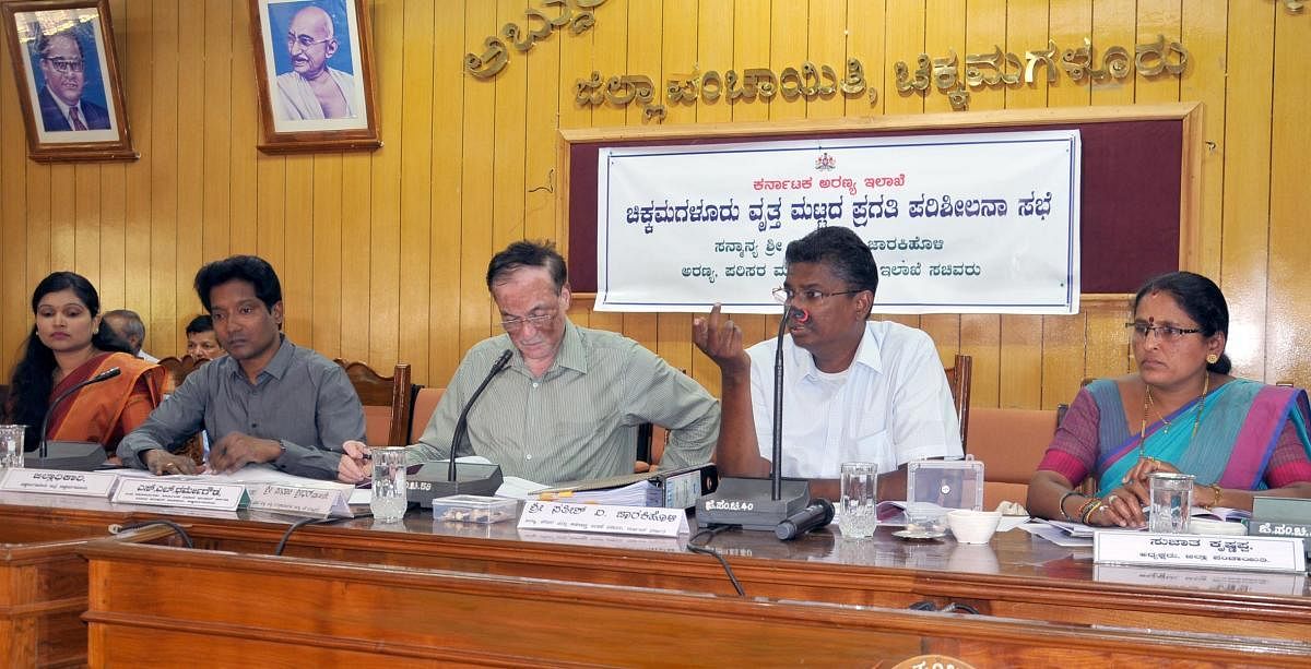 Forest minister Satish Jarkiholi (second from right) addresses the progress review meeting of Chikkamagaluru forest circle at the Zilla Panchayat auditorium in Chikkamagaluru on Wednesday.