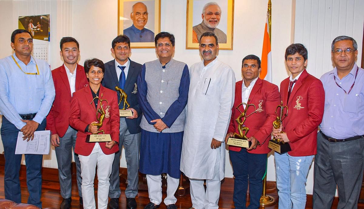 Union Railway Minister Piyush Goyal in a group photo with the National Award-winning Railway sportspersons, in New Delhi. (PIB/PTI Photo)