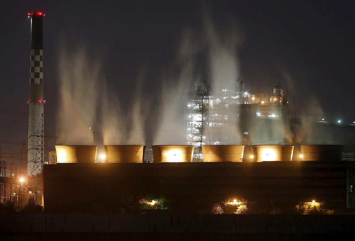 Smoke billows out from the cooling towers of a coal-fired power plant (Reuters Photo)
