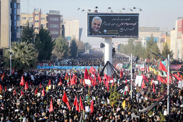 Iranian people attend a funeral procession and burial for Iranian Major-General Qassem Soleimani, head of the elite Quds Force, who was killed in an air strike at Baghdad airport, at his hometown in Kerman, Iran January 7, 2020. (Reuters Photo)