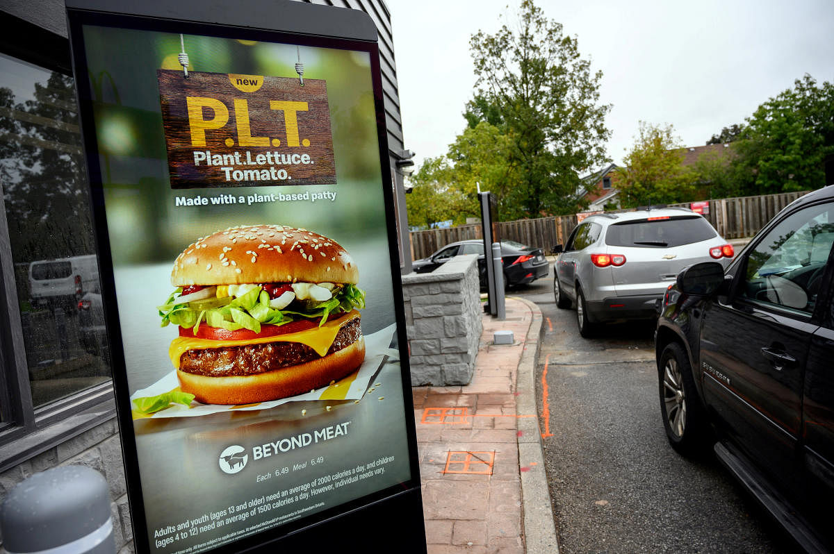 A sign promoting McDonald's "PLT" burger with a Beyond Meat plant-based patty at one of 28 test restaurant locations in London, Ontario. (REUTERS photo)