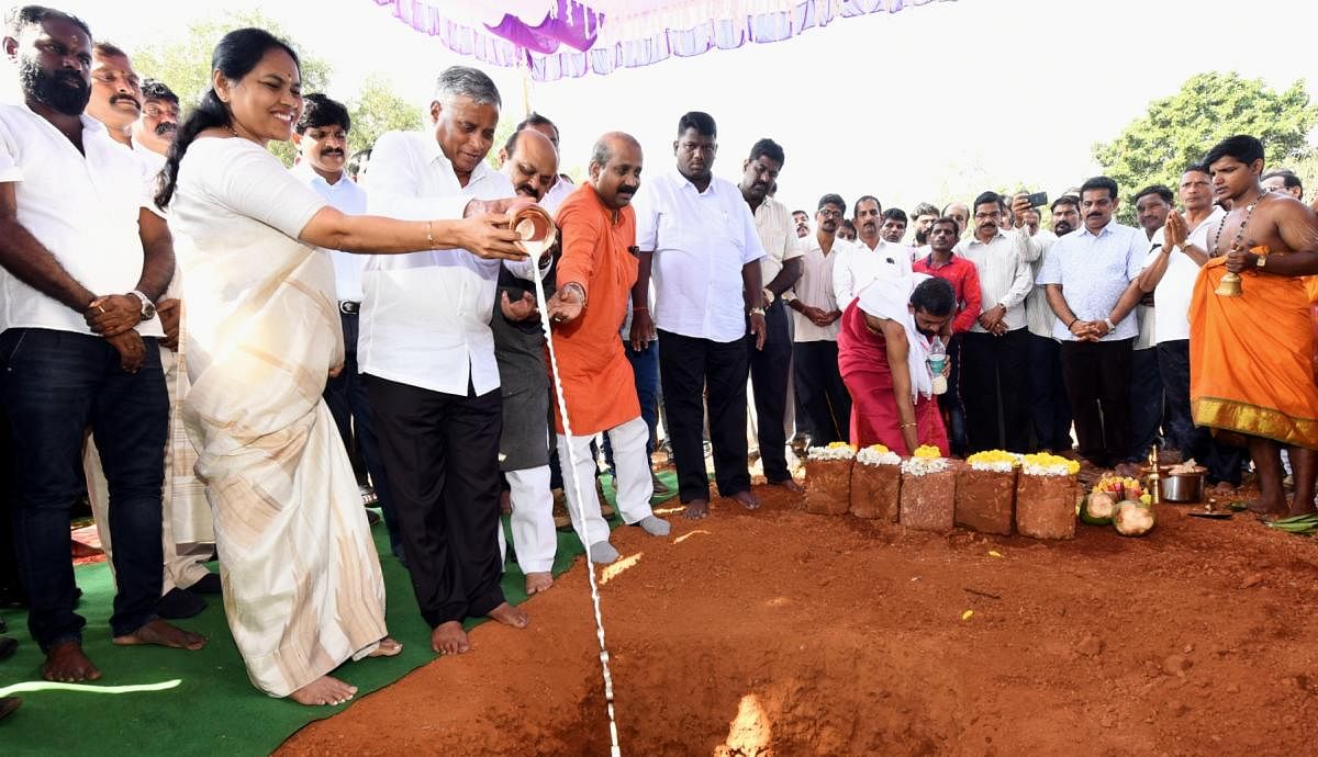 Housing Minister V Somanna lays the foundation stone for the construction of 460 houses on 8.22 acres of land at Herga in Saralebettu ward in Udupi on Wednesday.