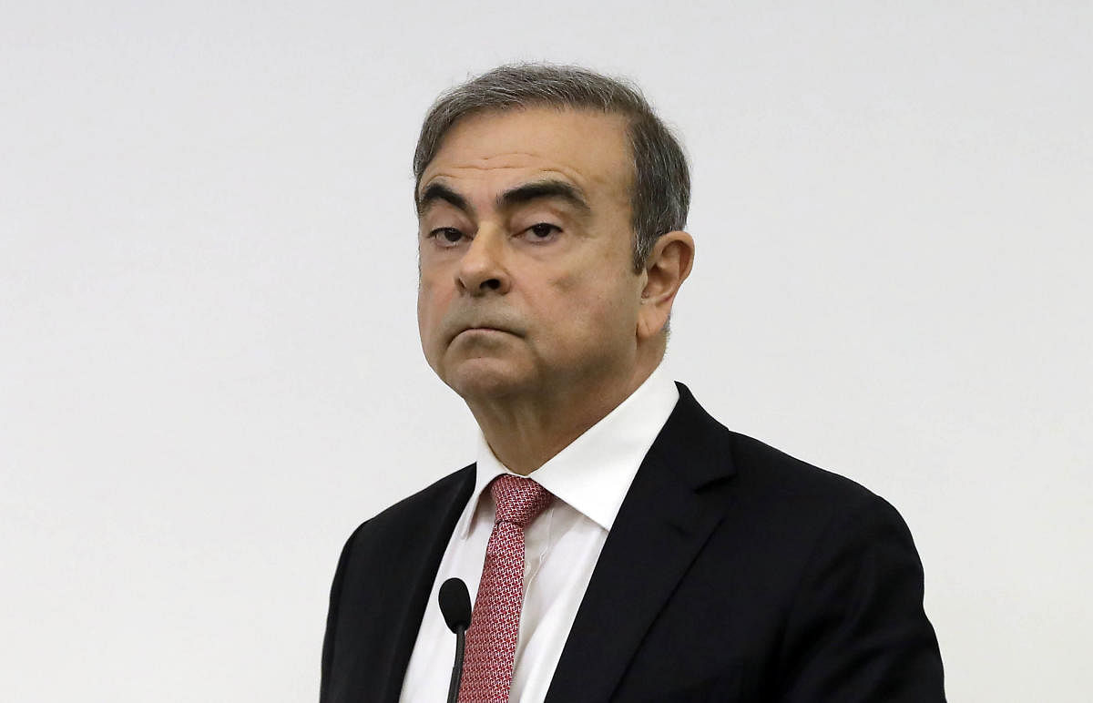 TOPSHOT - Former Renault-Nissan boss Carlos Ghosn looks on before addressing a large crowd of journalists on his reasons for dodging trial in Japan, where he is accused of financial misconduct, at the Lebanese Press Syndicate in Beirut on January 8, 2020.