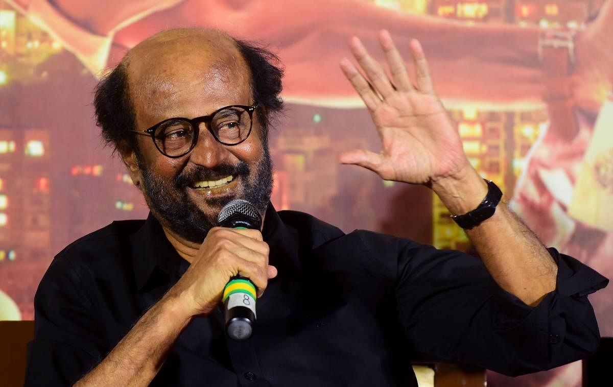 Thousands of die-hards would keep a vigil outside theatres across Tamil Nadu to catch their Thalaivar on screen at the break of the dawn. (AFP photo)
