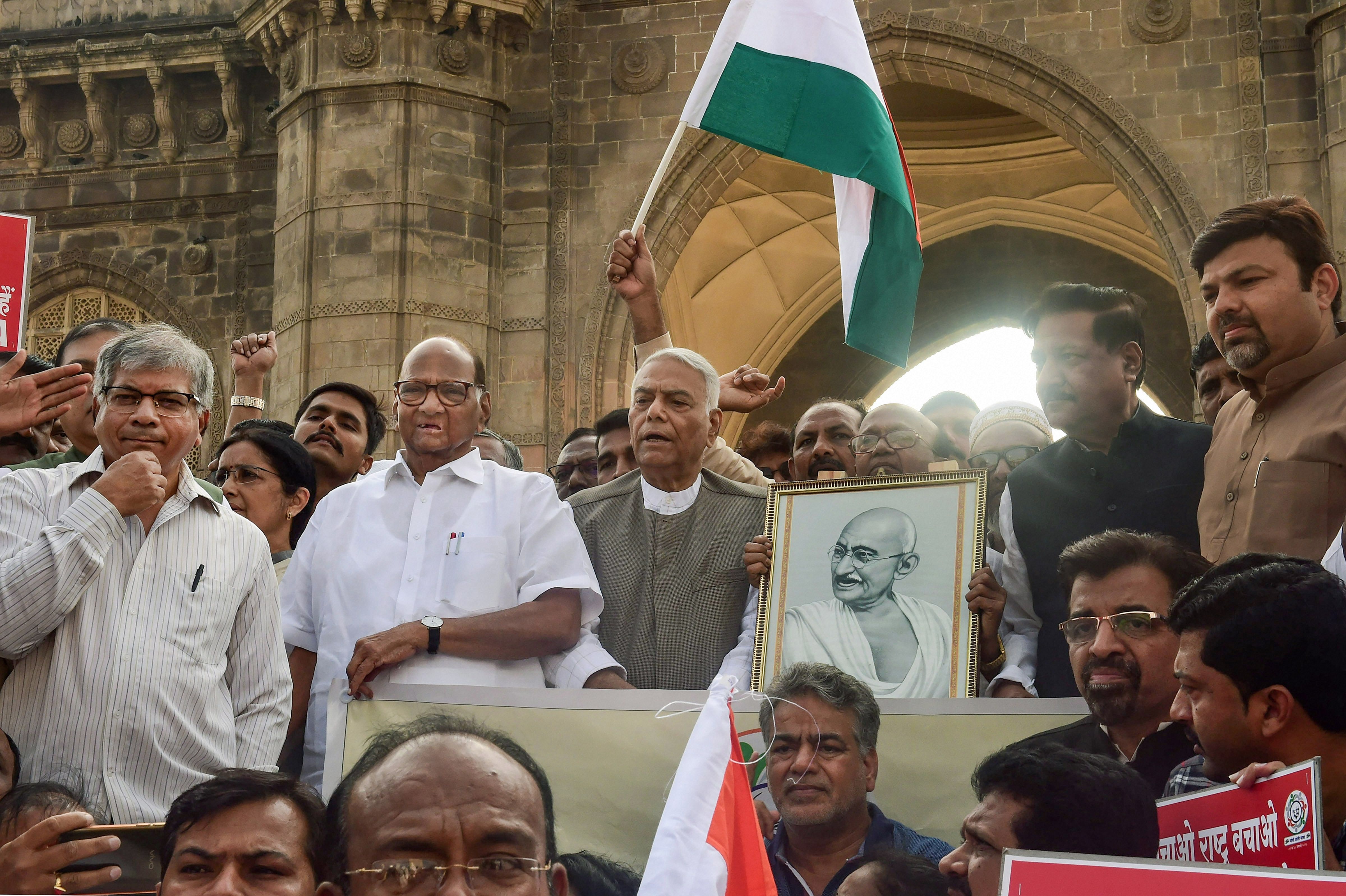 Former union minister Yashwant Sinha, with NCP chief Sharad Pawar and former Maharashtra CM Prithviraj Chavan and other leaders at the launch of 'Gandhi Shanti Yatra' from the Gateway of India in Mumbai. (PTI Photo)