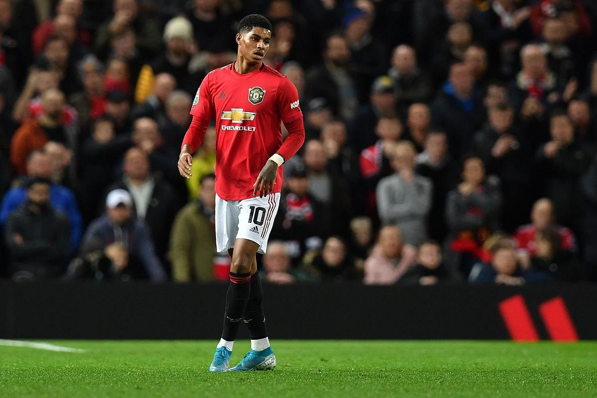 Manchester United's English striker Marcus Rashford reacts during the English League Cup semi-final first leg football match between Manchester United and Manchester City at Old Trafford in Manchester. (AFP Photo)