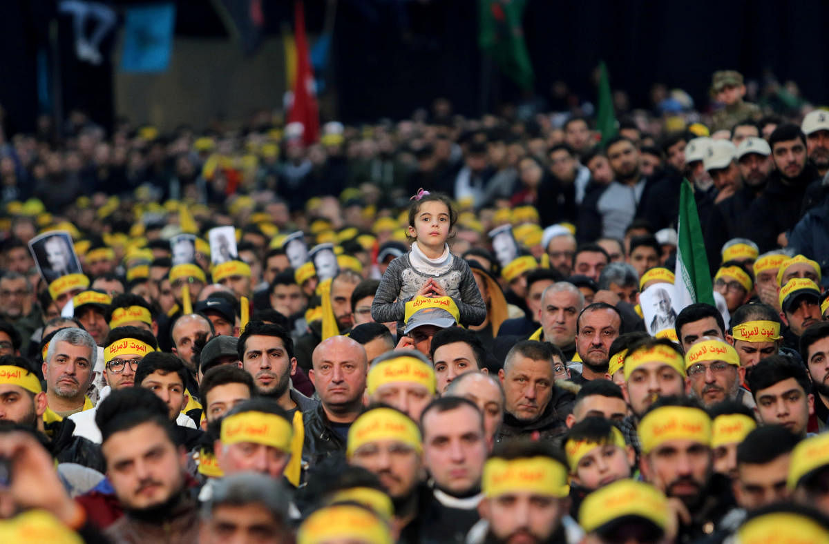 FILE PHOTO: Lebanon's Hezbollah supporters attend a funeral ceremony rally to mourn Qassem Soleimani, head of the elite Quds Force, who was killed in an air strike at Baghdad airport, in Beirut's suburbs. Reuters