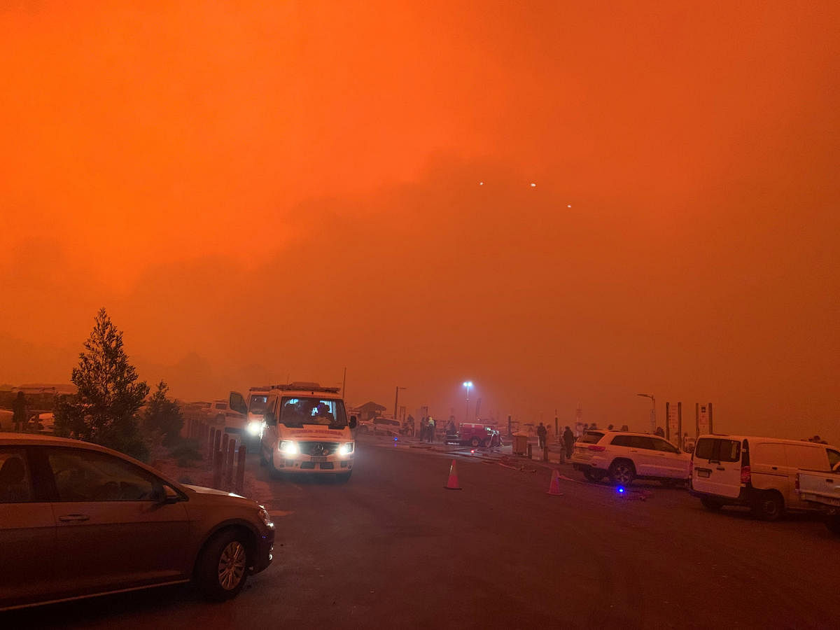 As many as four thousand people are trapped on the foreshore of the encircled seaside town of Mallacoota, as smoke turned day to night and the authorities said nearby fires were causing extreme thunderstorms and "ember attacks". Photo/Reuters