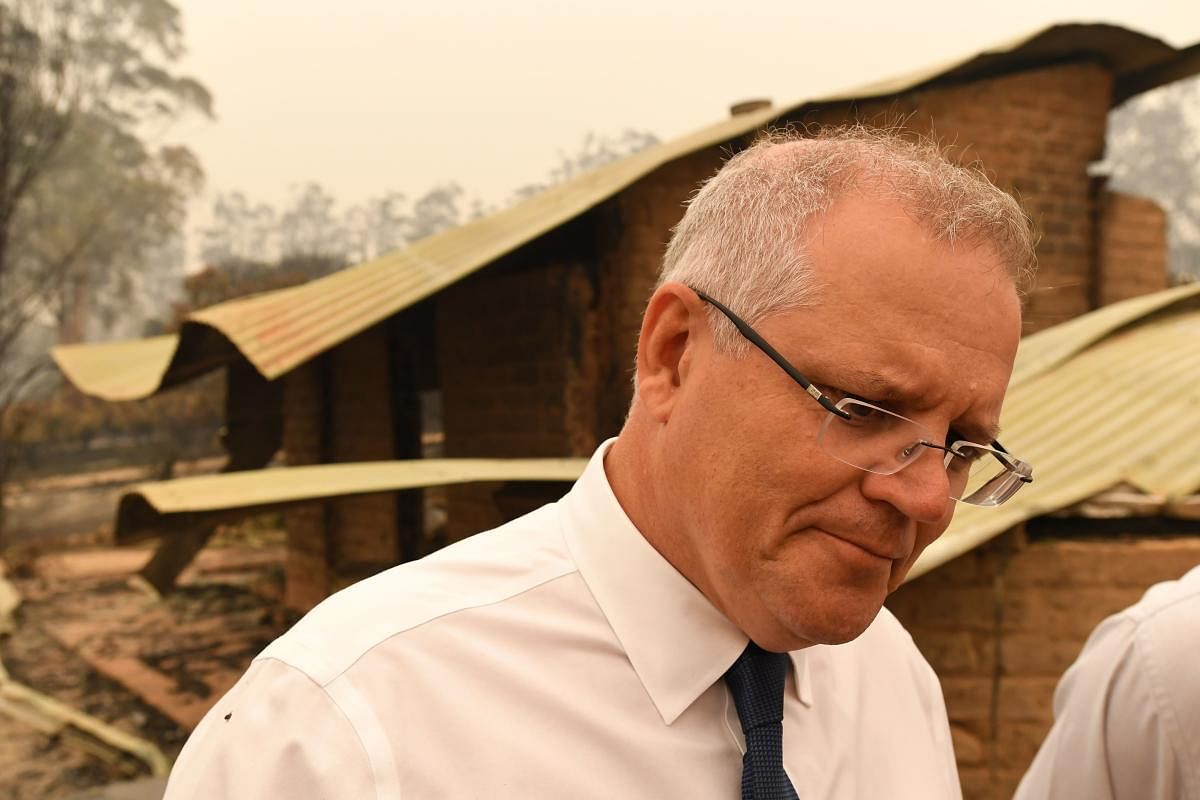 Australia's Prime Minister Scott Morrison visits a wildflower farm in an area devastated by bushfires in Sarsfield, Victoria state on January 3, 2020. (Photo Credit: AFP)