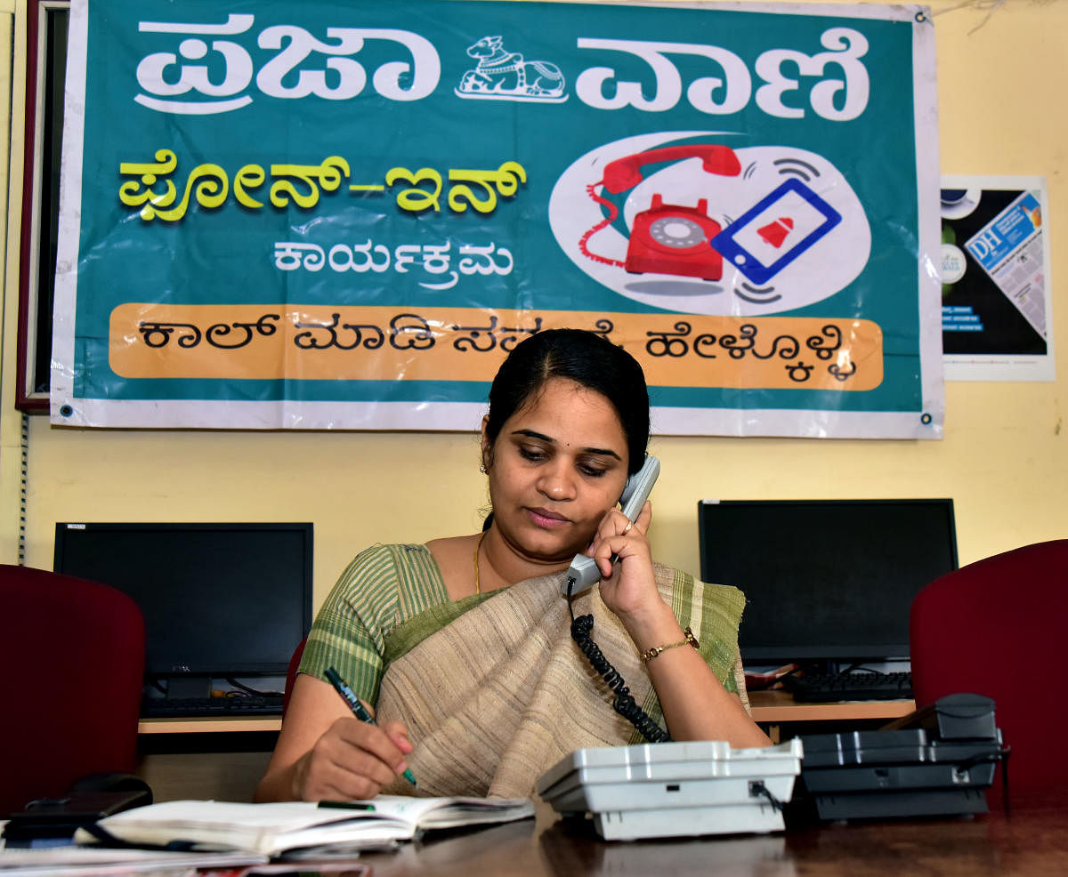 Deputy Commissioner Sindhu B Rupesh speaks to a caller during the Prajavani-DH phone-in programme at the Prajavani-Deccan Herald office in Mangaluru on Thursday.