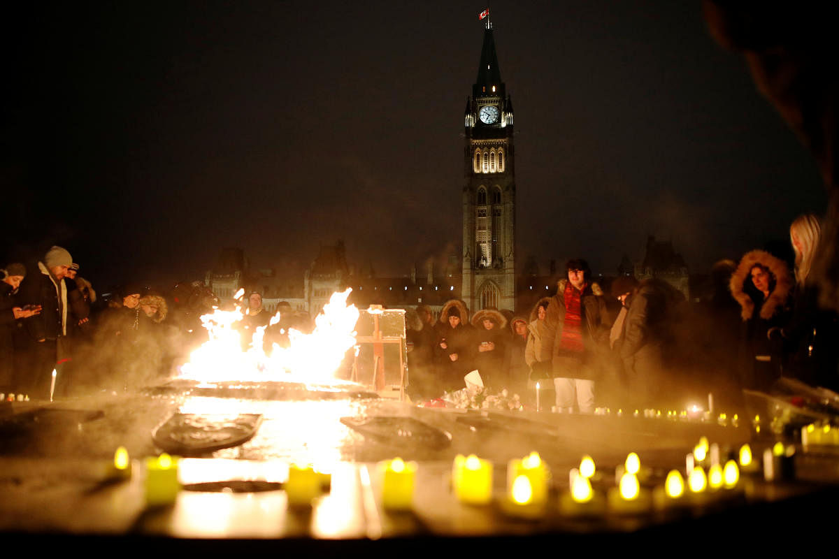 Hundreds attended a candle light vigil for the victims of Ukraine International Airlines flight PS-752 on Parliament Hill in Ottawa, Ontario, Canada January 9, 2020. (Reuters Photo)