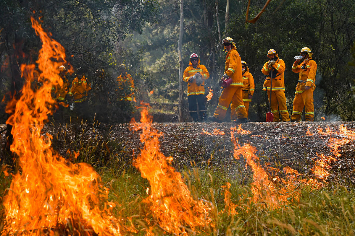 A supplied image obtained January 8, 2020 shows Country Fire Authority (CFA) strike teams performing controlled burning west of Corryong. (Reuters Photo)