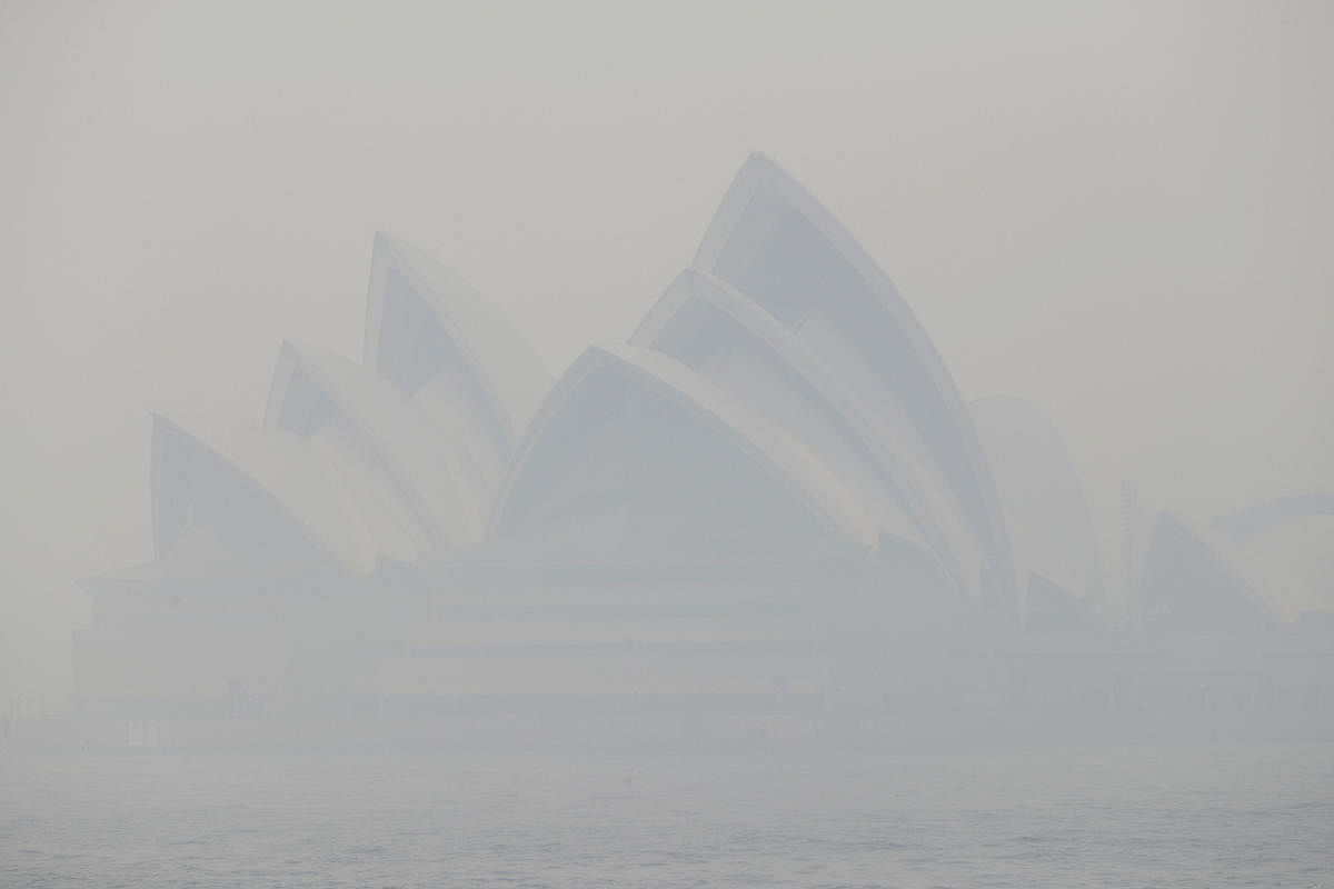 Thick smoke from wildfires shroud the Opera House in Sydney, Australia, Tuesday, Dec. 10, 2019. Hot dry conditions have brought an early start to the fire season. AP/PTI