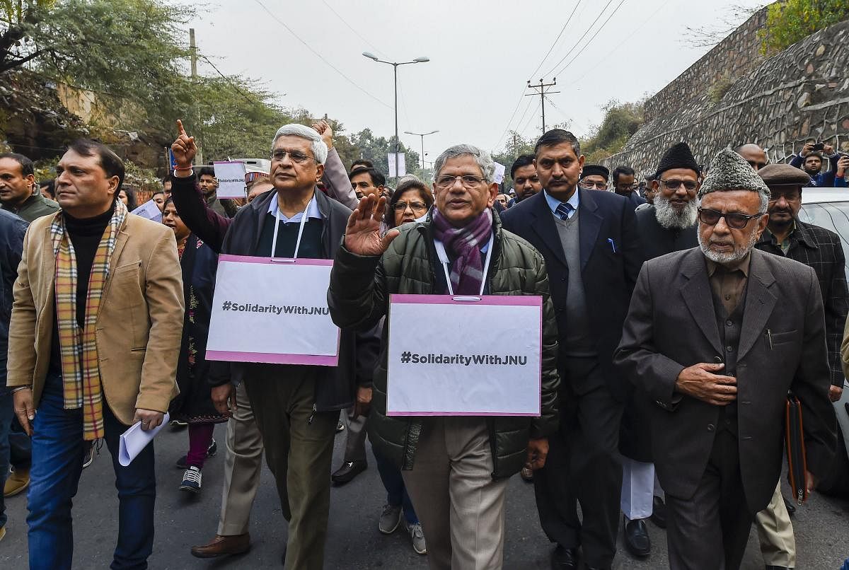 Members of JNUTA raising slogans in a protest against Sunday's violence. (PTI Photo)