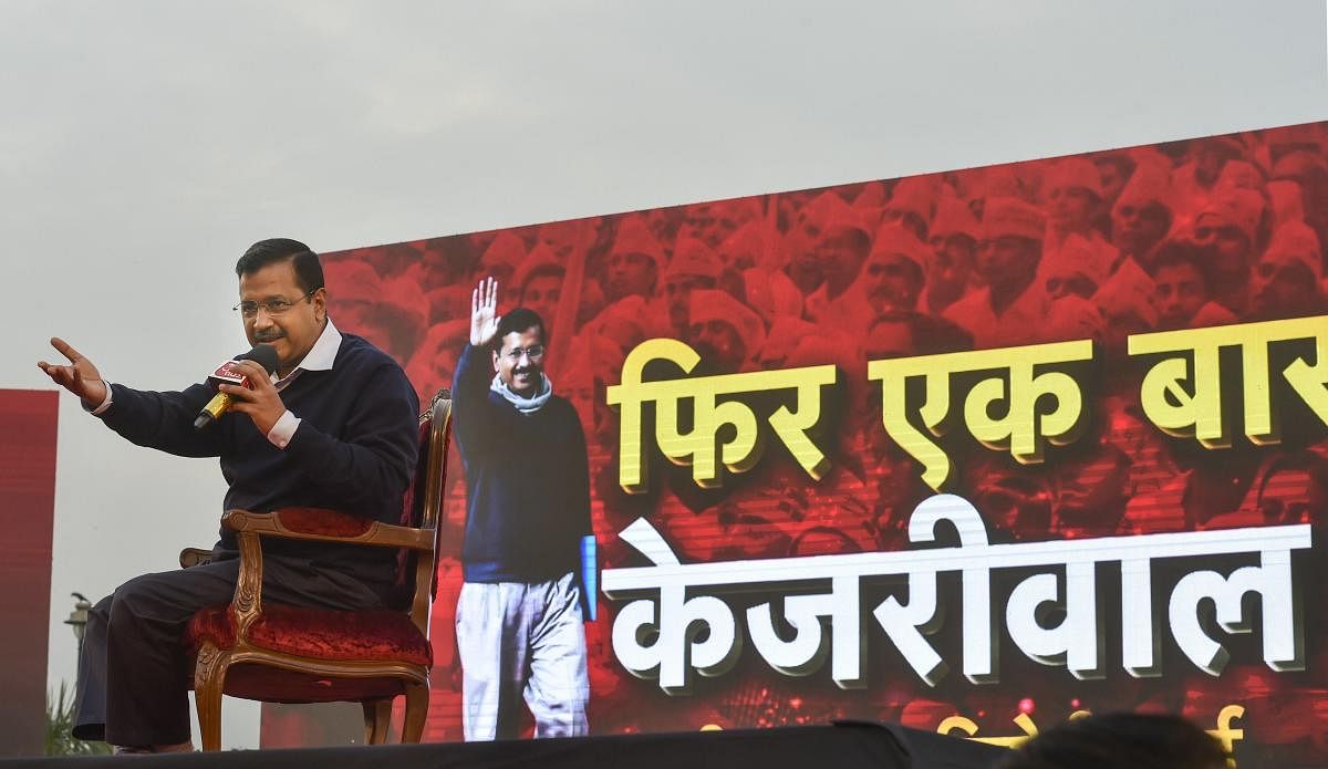 Delhi CM Arvind Kejriwal addresses a gathering on the issue of 5-year report card of Delhi govt. ahead of the State Assembly elections. (PTI PHOTO)