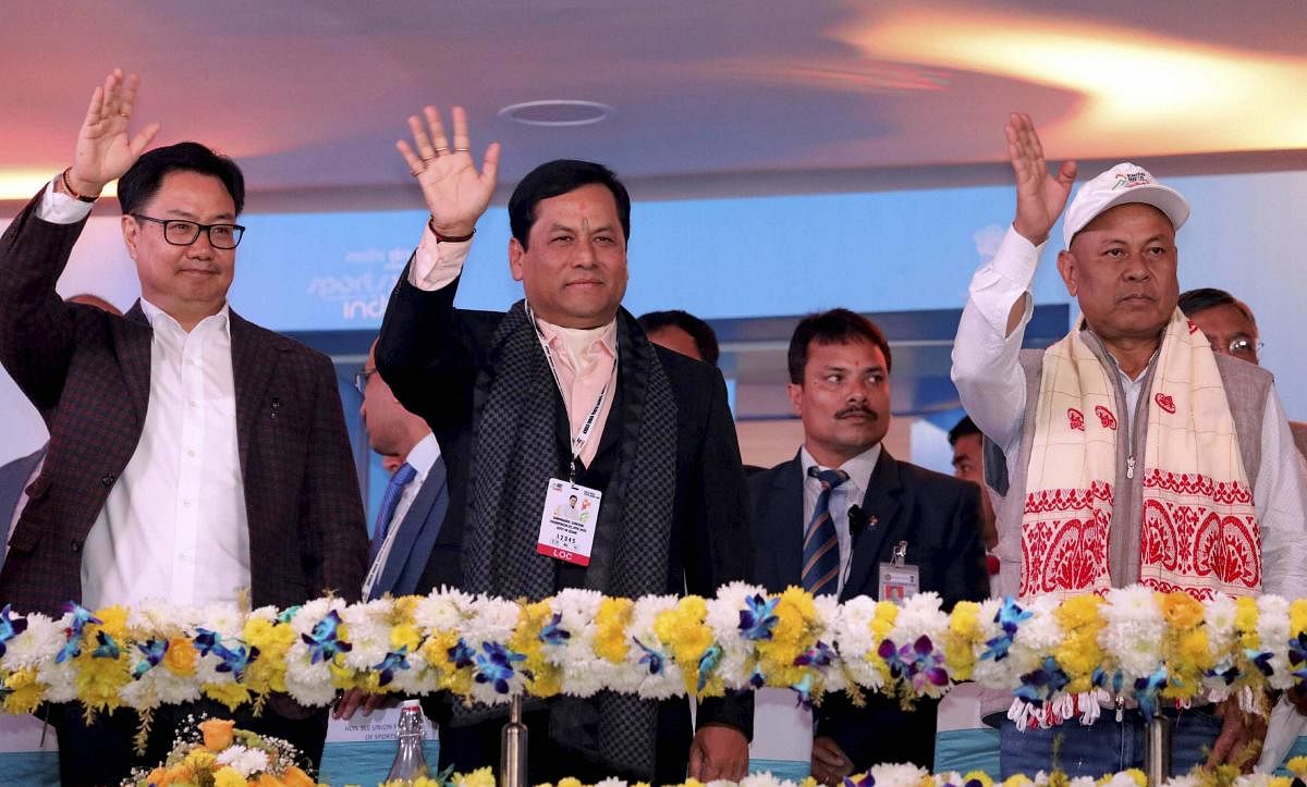 Assam Chief Minister Sarbananda Sonowal, Union Sports Minister Kiren Rijiju wave at the contingents taken part in the 3rd Khelo India Youth Games 2020 at Indira Gandhi Athletic Stadium in Guwahati. (PTI Photo)