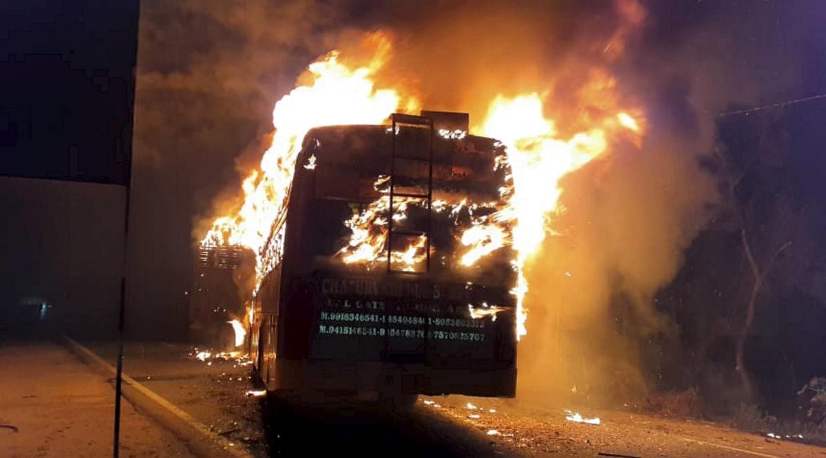 A bus catches fire after collision with a truck on GT Road. at Kannauj in Uttar Pradesh , Friday 10 Jan 2020.. (PTI Photo)