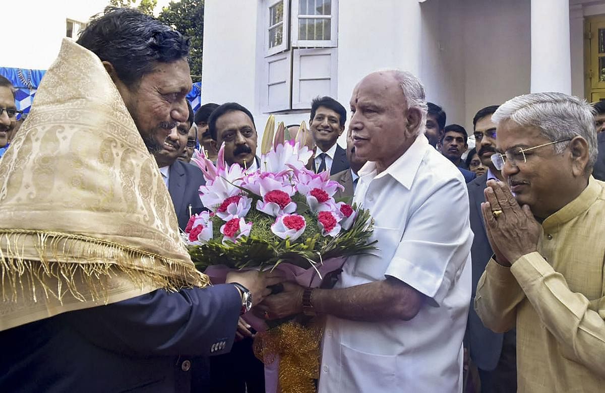 Karnataka Chief Minister BS Yediyurappa with Chief Justice of India S A Bobde during the meeting, in Bengaluru. (PTI Photo)
