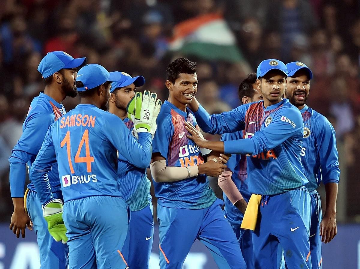 ndian team celebrates victroy against Sri Lanka during the third T20 cricket match at Maharashtra Cricket Association Stadium in Pune. (Credit: PTI)