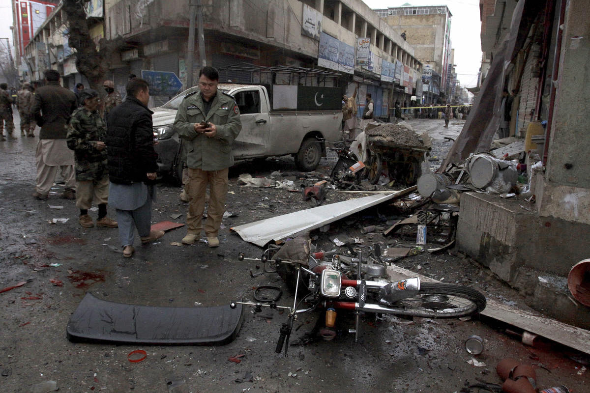 Quetta: Pakistani police officers examine the site of a bomb explosion in Quetta. (AP Photo)