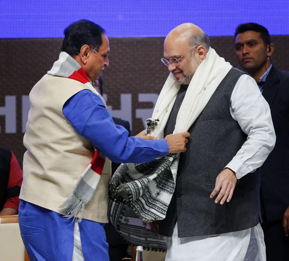 Gujarat Chief Minister Vijay Rupani welcomes Union Home Minister Amit Shah during an event to inaugurate various projects of Gujarat police. (Credit: PTI)