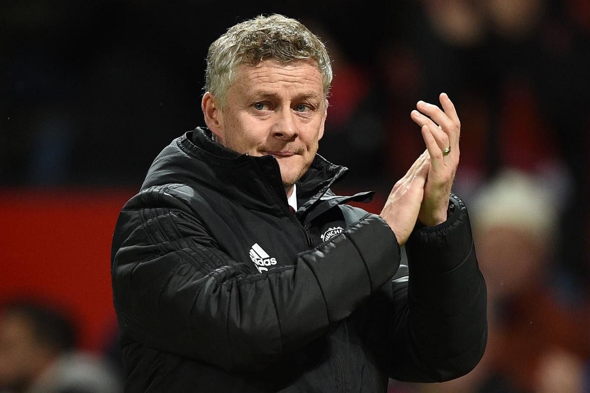 Manchester United's Norwegian manager Ole Gunnar Solskjaer gesture at the end of the English Premier League football match between Manchester United and Norwich City. AFP