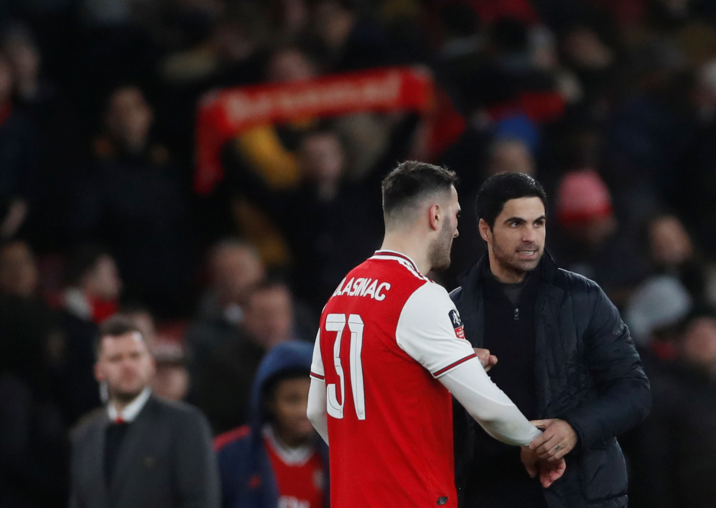 Arsenal manager Mikel Arteta celebrates with Sead Kolasinac after the match. (Reuters Photo)