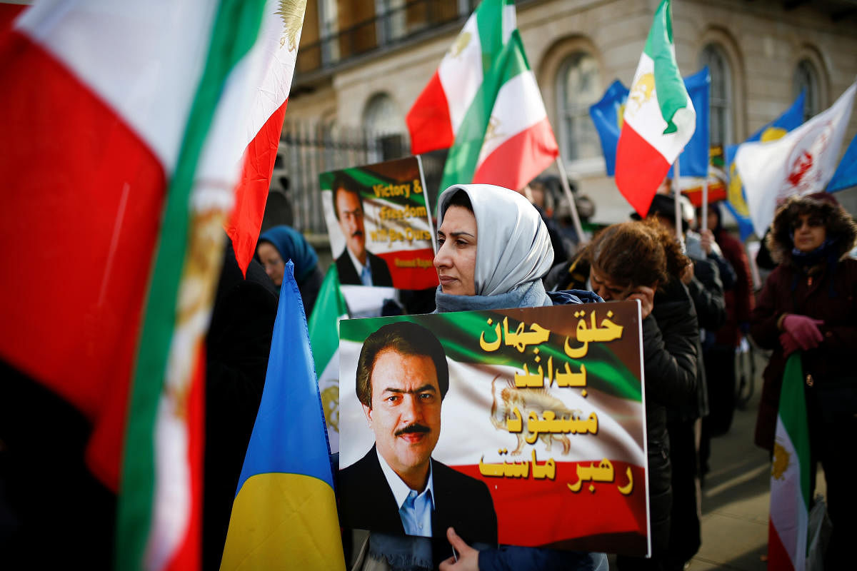 People hold a demonstration, in support of the ongoing anti-regime protests happening in Iran. (Reuters Photo)