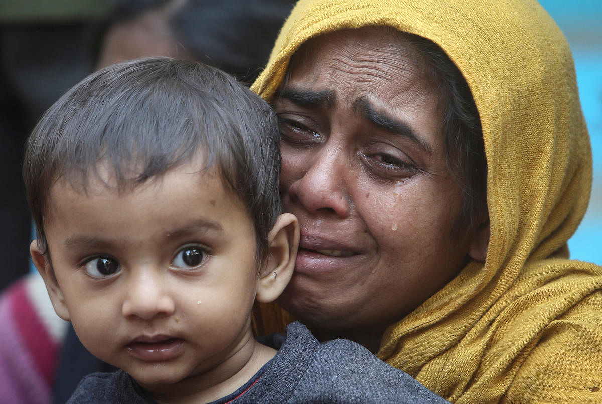File Reuters picture of a Rohingya Muslim woman crying holding her daughter 