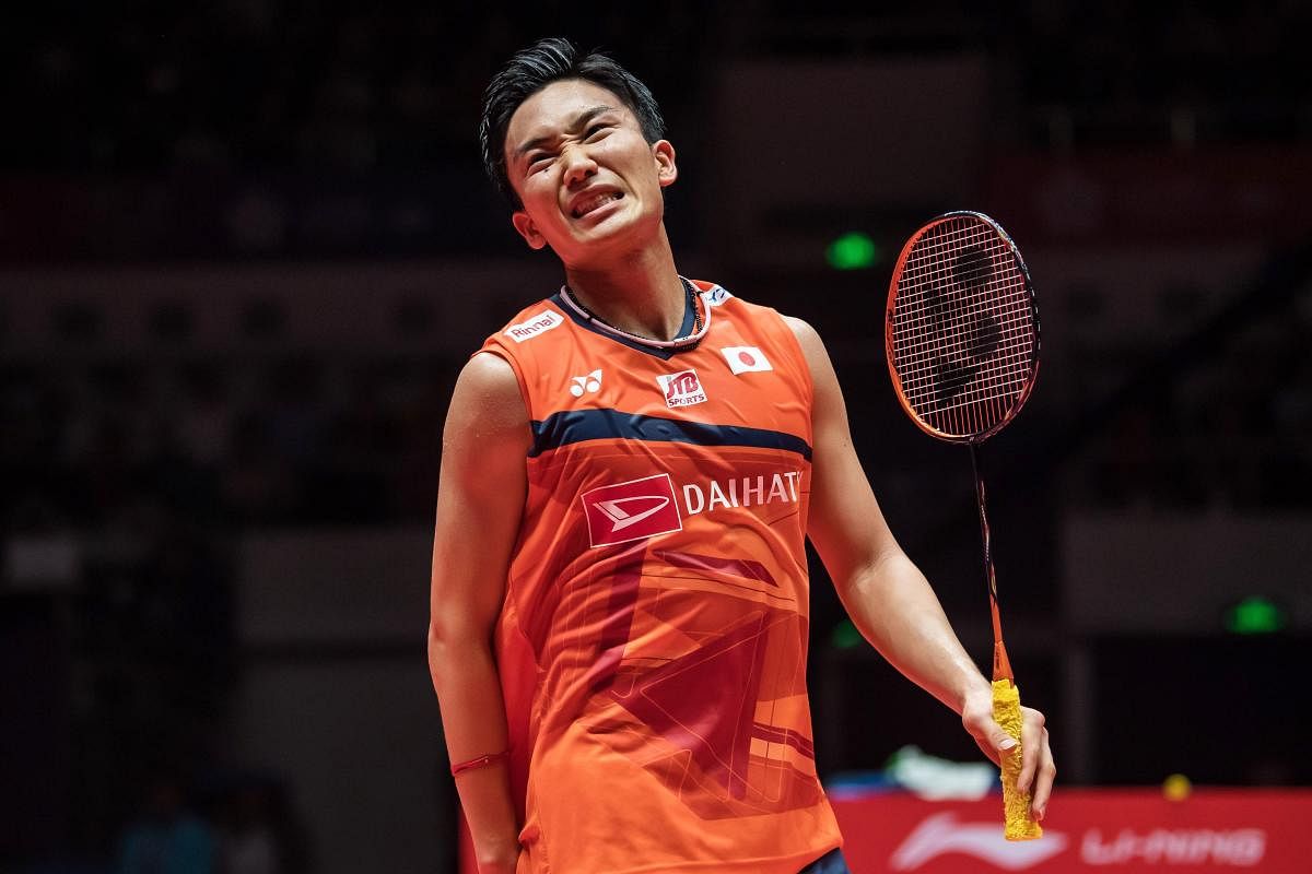 Kento Momota of Japan reacts during his men's singles final match against Anthony Sinisuka Ginting of Indonesia at the BWF World Tour Finals badminton tournament. (AFP PHOTO)