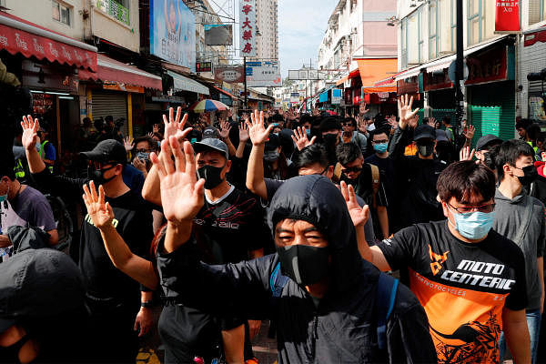 Anti-government protesters march during anti-parallel trading protest at Sheung Shui, a border town in Hong Kong. (Reuters Photo)