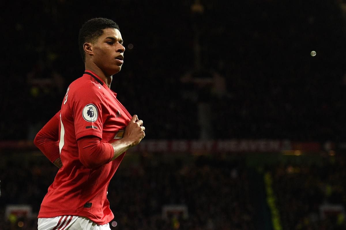 Manchester United's English striker Marcus Rashford celebrates scoring their second goal during the English Premier League football match between Manchester United and Norwich City at Old Trafford in Manchester, north-west England. (AFP PHOTO)