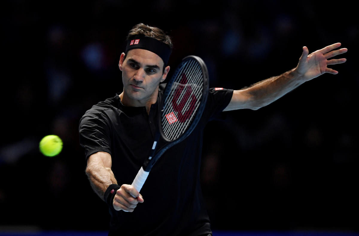 Switzerland's Roger Federer in action during his group stage match against Serbia's Novak Djokovic (Reuters Photo)
