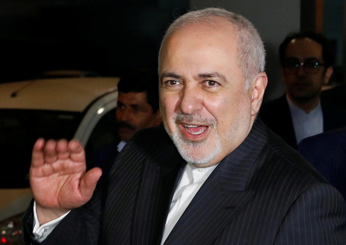 Iranian Foreign Minister Javad Zarif gestures upon his arrival at the airport in New Delhi. (Reuters photo)