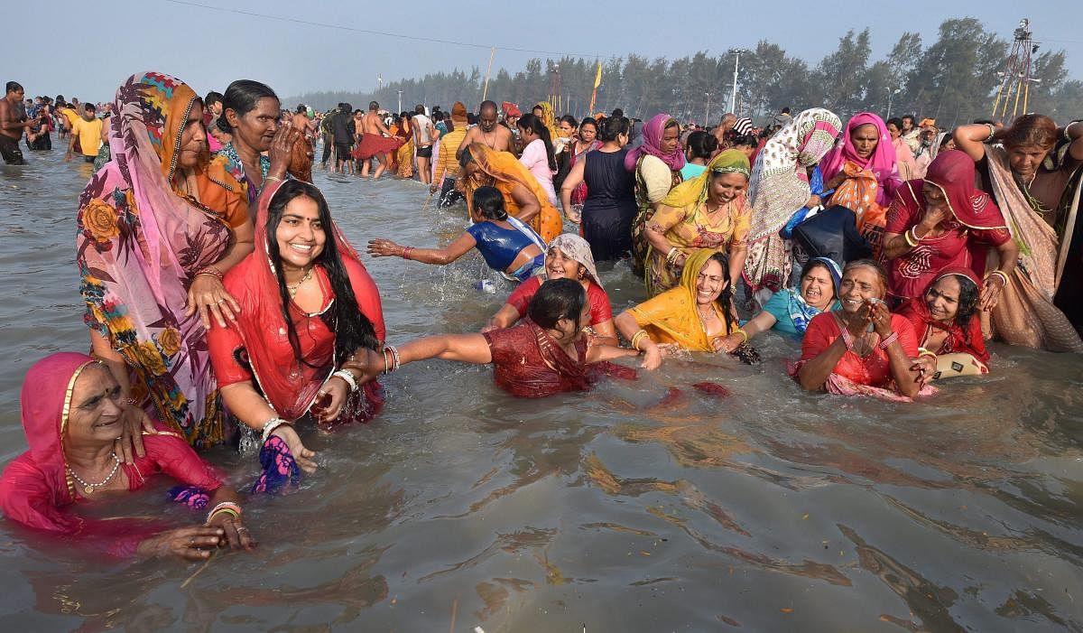 Devotees taking holy dip at Gangasagar (Sagar Island) (PTI Photo)