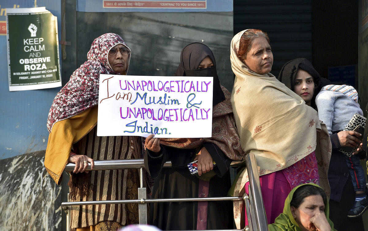 Protestors participate in a demonstration against the Citizenship (Amendment) Act and NRC at Shaheen Bagh in New Delhi. (PTI PHOTO)
